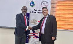 PPCC Executive Director, Bodger Scott Johnson, shakes hands with Joseph Zadrozny, the United States Chargé d’Affaires to Liberia.