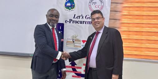 PPCC Executive Director, Bodger Scott Johnson, shakes hands with Joseph Zadrozny, the United States Chargé d’Affaires to Liberia.